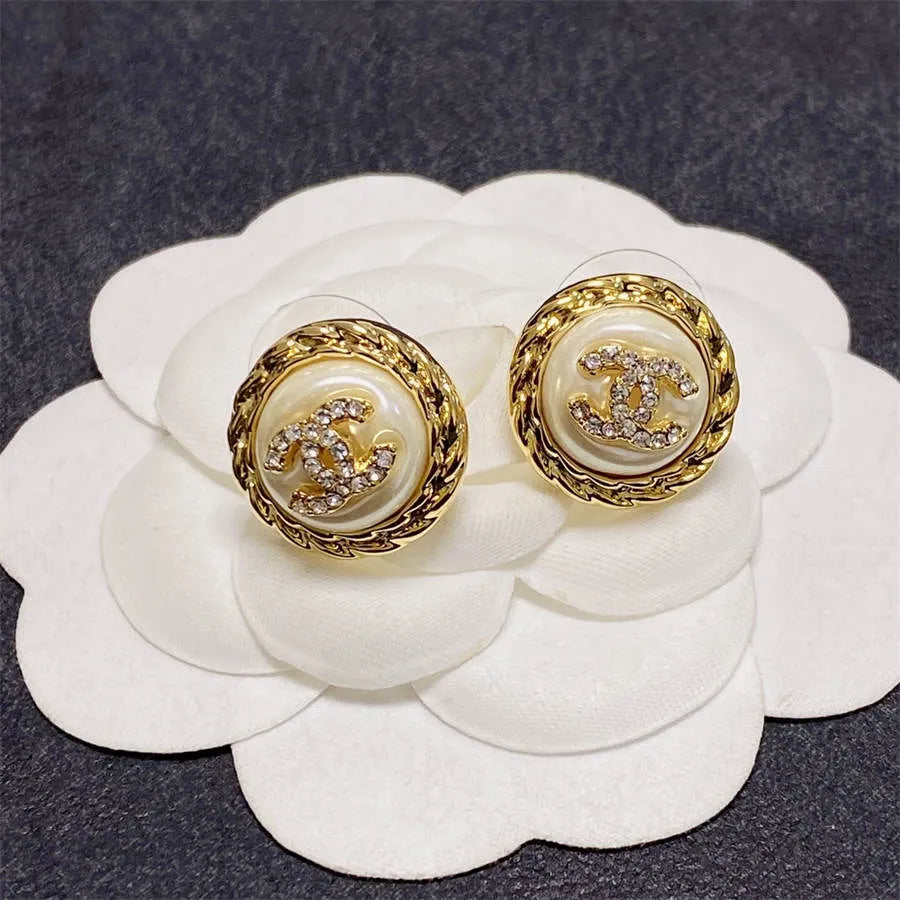 Chanel medium antique gold double C stud earrings with diamonds