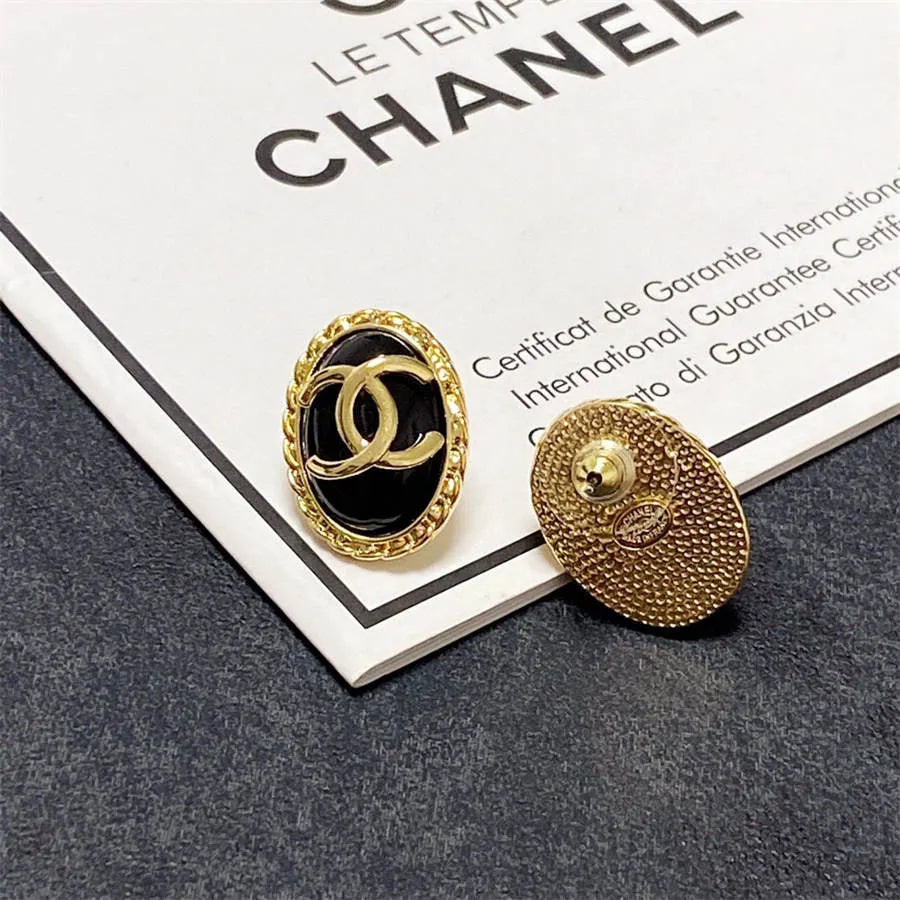 Chanel double C gold-rimmed earrings