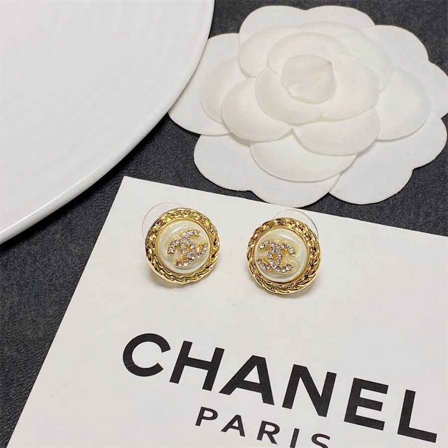 Chanel medium antique gold double C stud earrings with diamonds