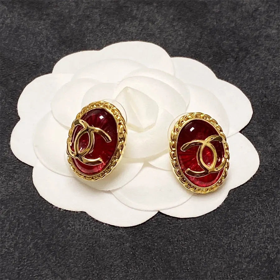 Chanel double C gold-rimmed earrings