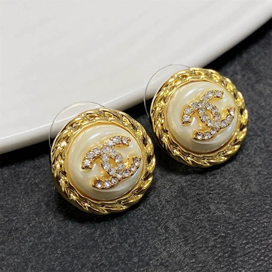 Chanel medium antique gold double C stud earrings with diamonds