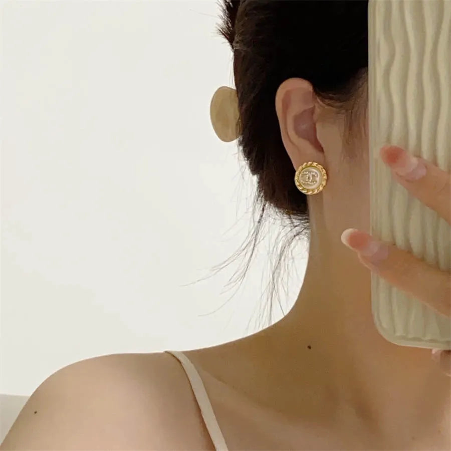 Chanel medium antique gold double C stud earrings with diamonds