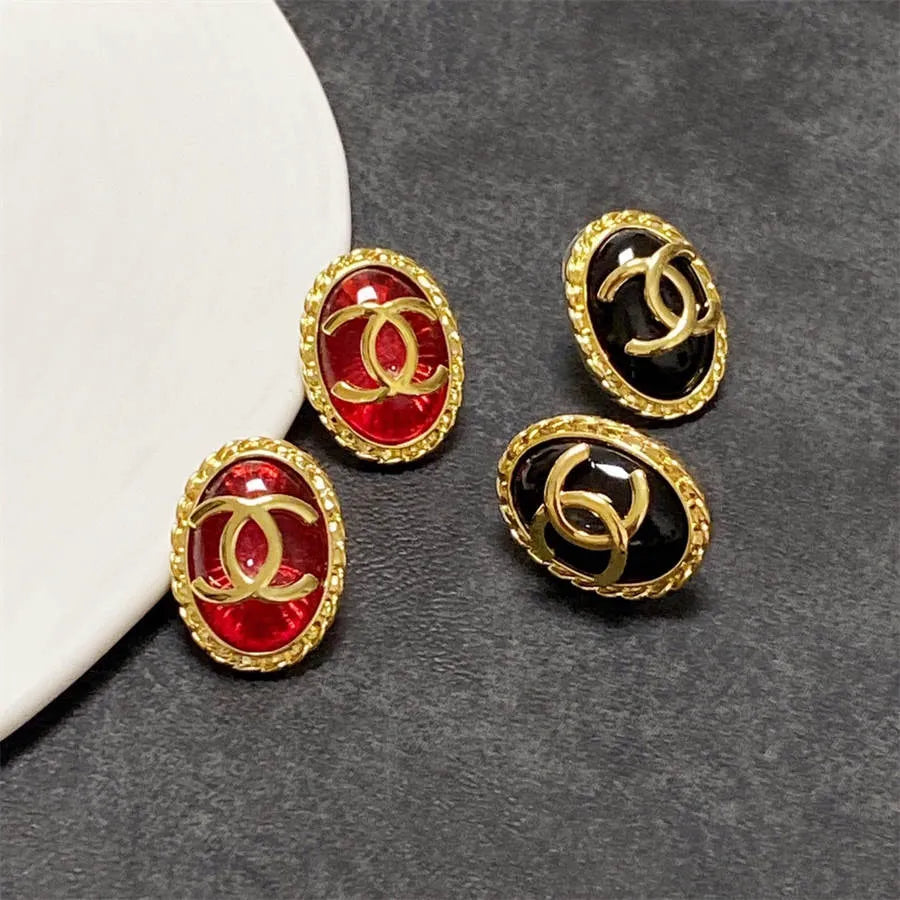 Chanel double C gold-rimmed earrings