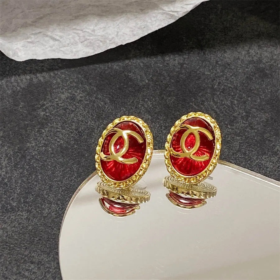 Chanel double C gold-rimmed earrings