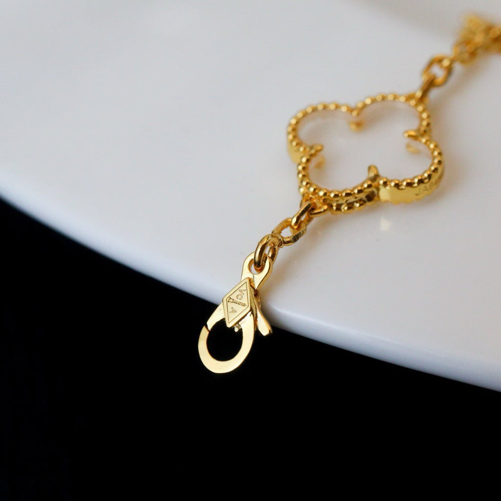 New CLOVER 5 MOTIF ROCK CRYSTAL BRACELET