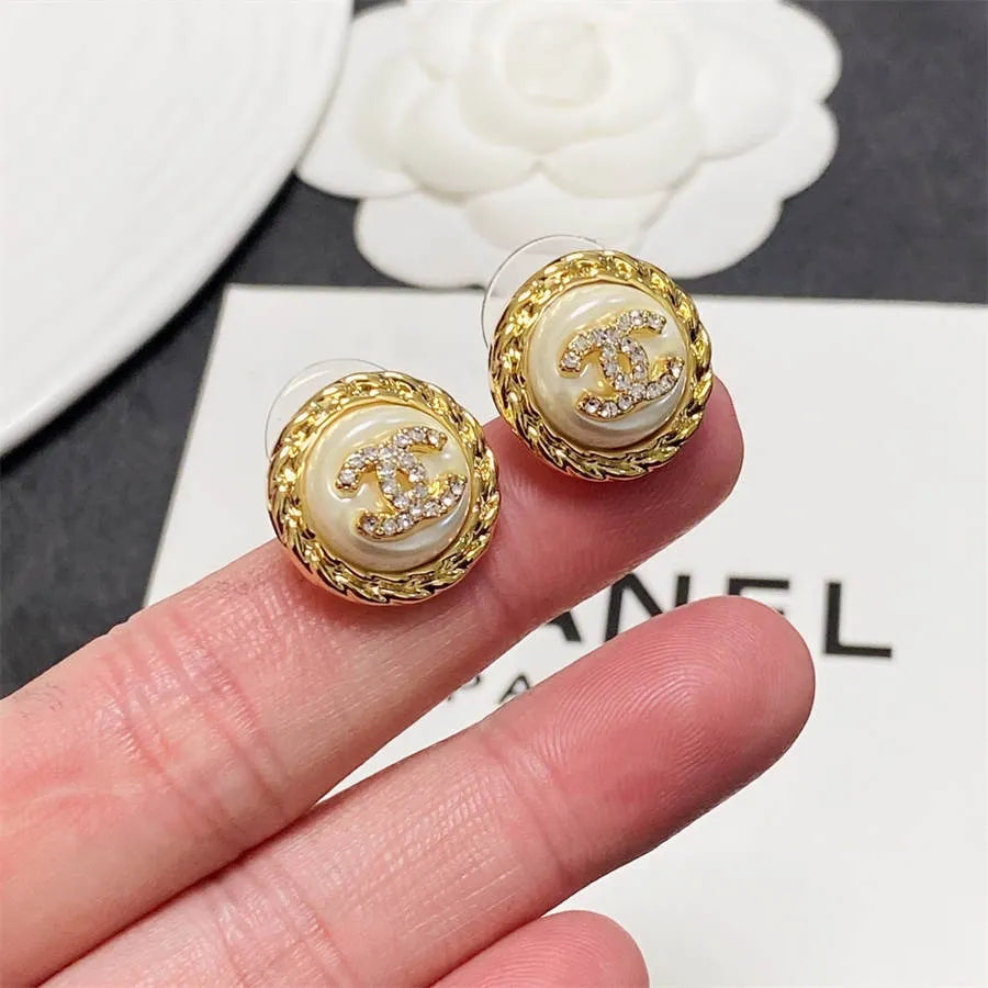 Chanel medium antique gold double C stud earrings with diamonds