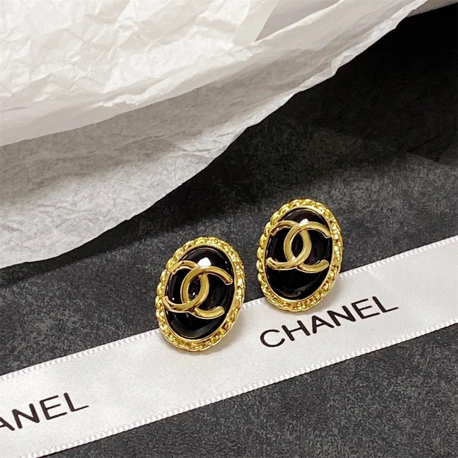 Chanel double C gold-rimmed earrings