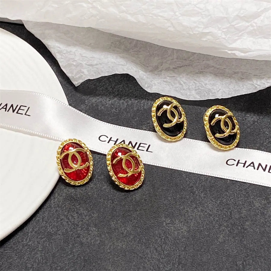 Chanel double C gold-rimmed earrings