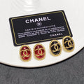 Chanel double C gold-rimmed earrings