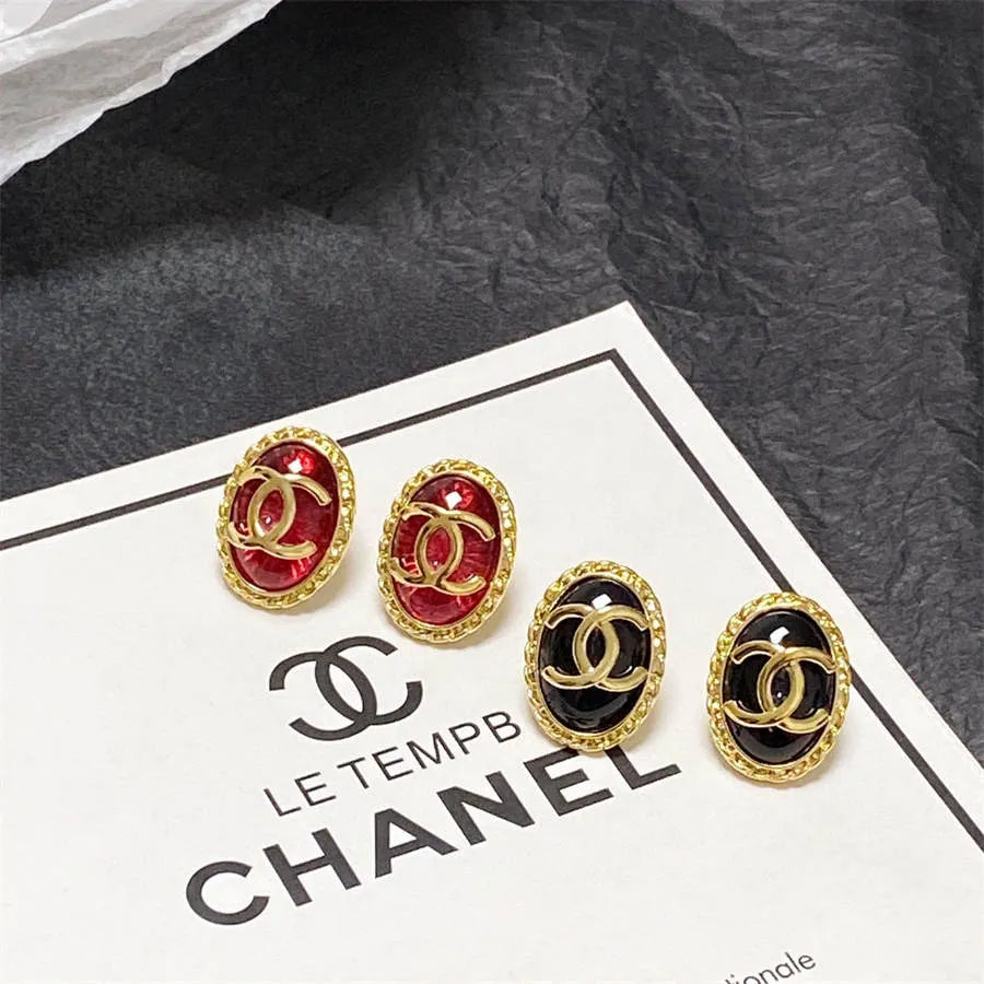 Chanel double C gold-rimmed earrings
