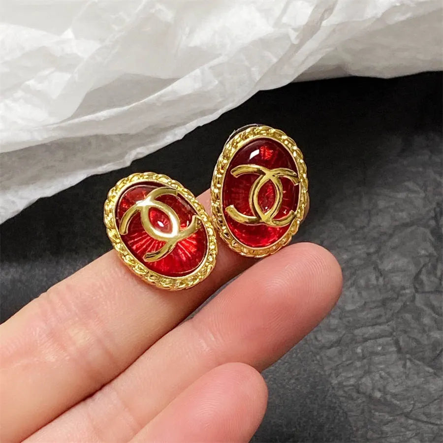 Chanel double C gold-rimmed earrings